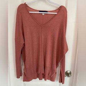Dark pink v-neck sweater from Francesca’s. Side splits. Ribbed detailing. Size M